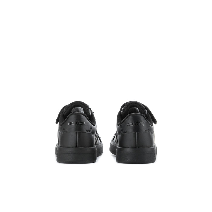 Kids black sneakers with padded collar and cushioned heel.