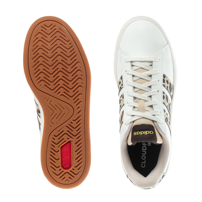 Women's adidas sneaker outsole and toe view, gum rubber sole and white upper