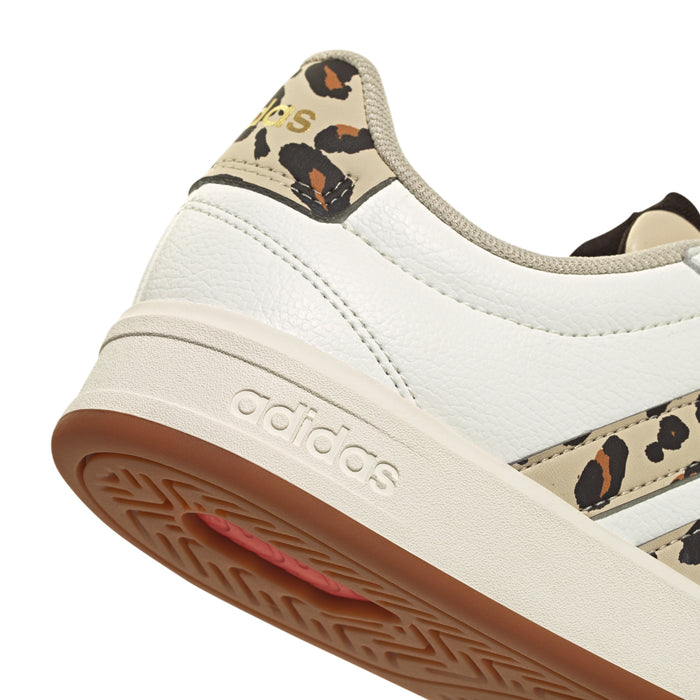 White adidas sneaker close-up of toe and outsole, leopard side stripe detail