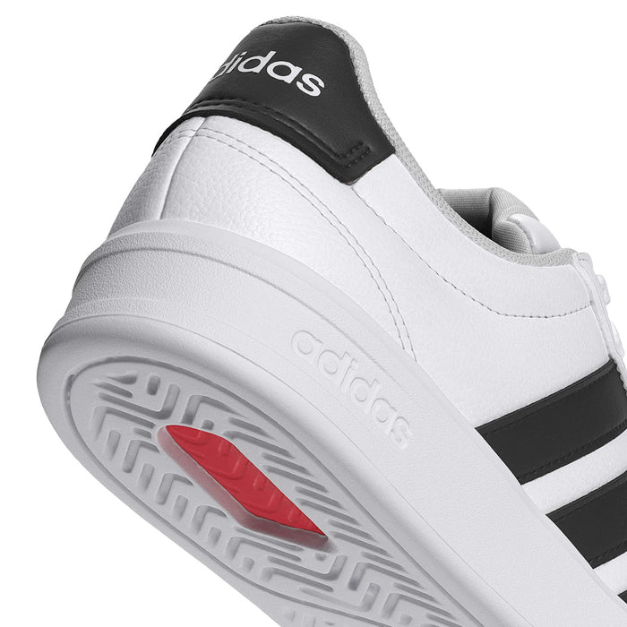 Women's adidas Grand Court 3.0 heel close-up, white outsole with red traction patch and adidas logo.