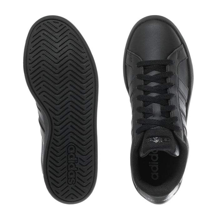 Black youth adidas sneakers with front view and outsole tread detail