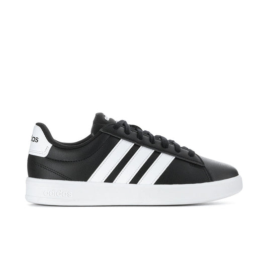 Men's black sneakers with white adidas stripes and black lace-up closure