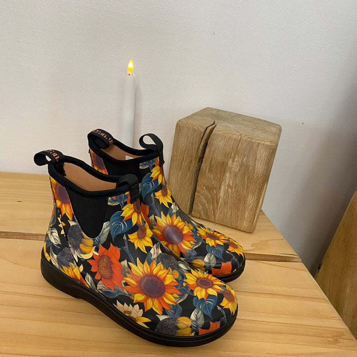 Green Comfort gummistöv el med solrosmönster – EnergySole™