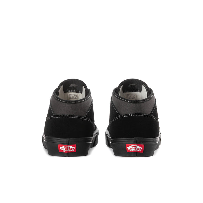 Men's black high-top sneakers from heel view with cushioned back and red label