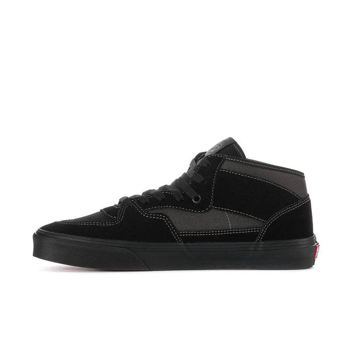 Men's black high-top sneakers side view with ankle strap and contrast stitching