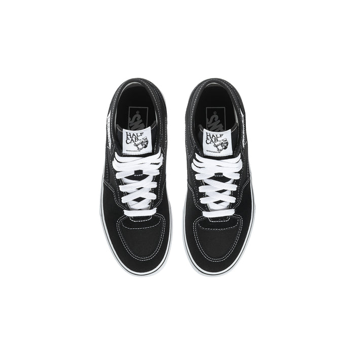 Youth black high-top sneakers with white laces, top view of two shoes