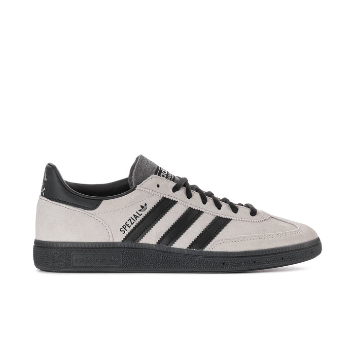 Light gray men's sneakers with black heel tab, three black stripes, suede upper