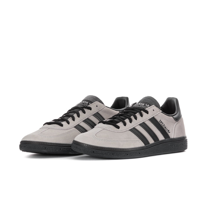 Light gray men's sneakers with black stripes and lace-up front, low profile