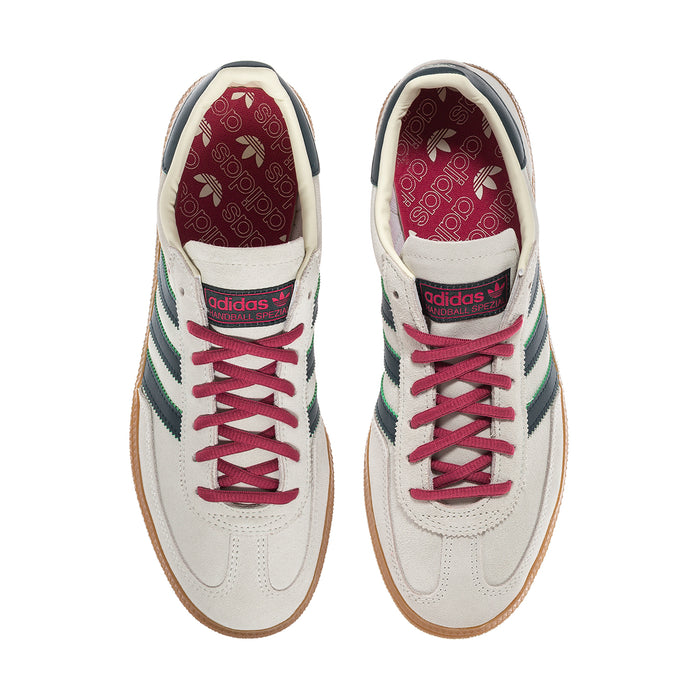 Men's Handball Spezial sneakers with pink lace eyelets, ivory leather, teal heel stripes.
