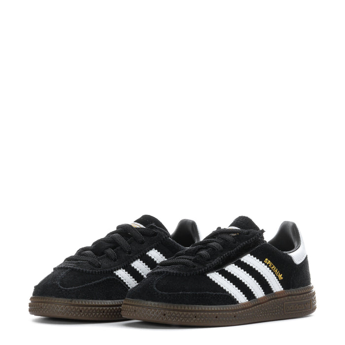 Pair of kids black low-top sneakers with white triple stripes, lace-up design, and gum soles.