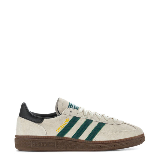 Youth sneakers with off-white leather upper, green striped side, gum rubber sole