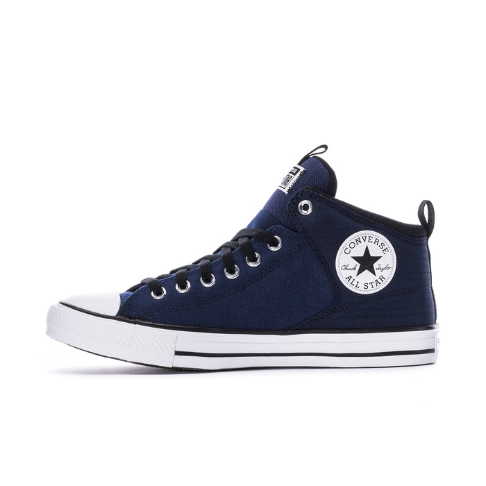 Navy low-profile high-top sneakers with white sole, black laces, and side logo patch