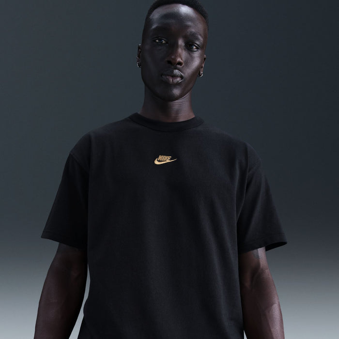 Men's black Nike short-sleeve t-shirt with gold swoosh logo on chest