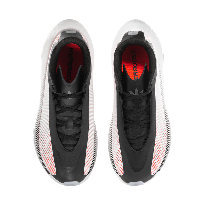 Men's black sneakers with red accent lining, black laces, and textured white upper