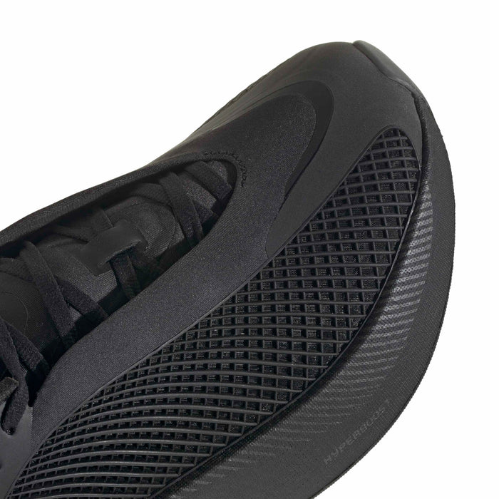 Close-up of men's black sneaker side with textured mesh and lace-up