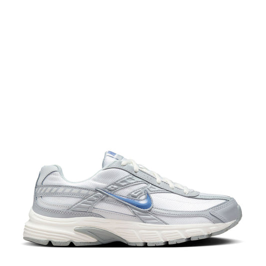 Women’s lace-up running shoe in white with gray panels and blue Nike Swoosh logo.