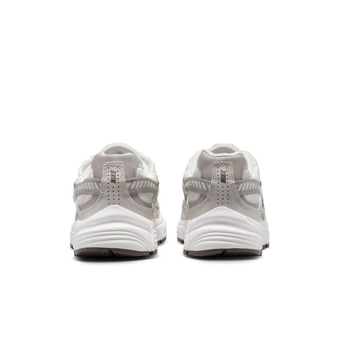 Nike women's running shoes, light bone with cushioned collar and chunky white sole