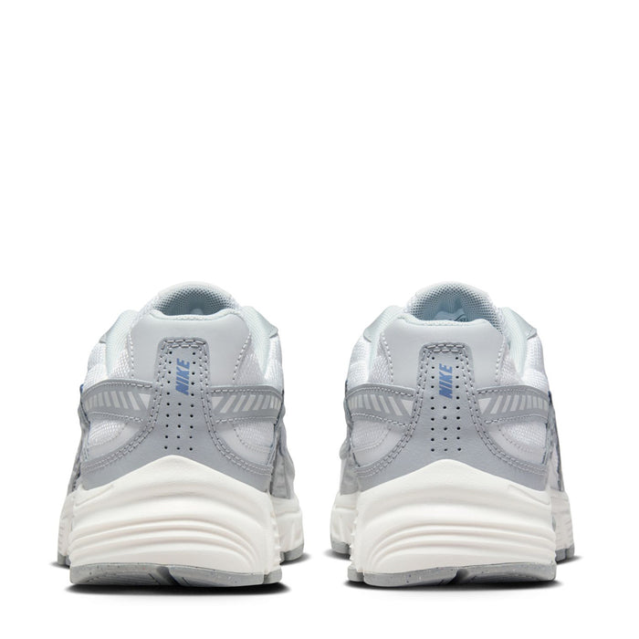Women’s white lace-up running shoes with gray heel tabs and patterned midsole cushioning.