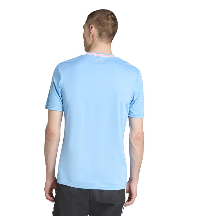 Men's light blue soccer jersey back view with V-neck and pink/white striped collar
