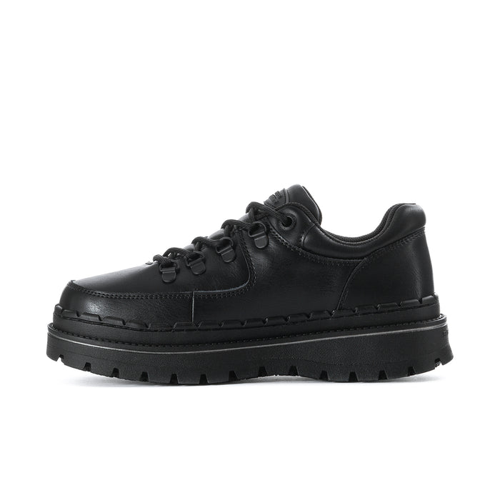 Women's black slip-resistant lace-up sneaker, angled side profile with lugs