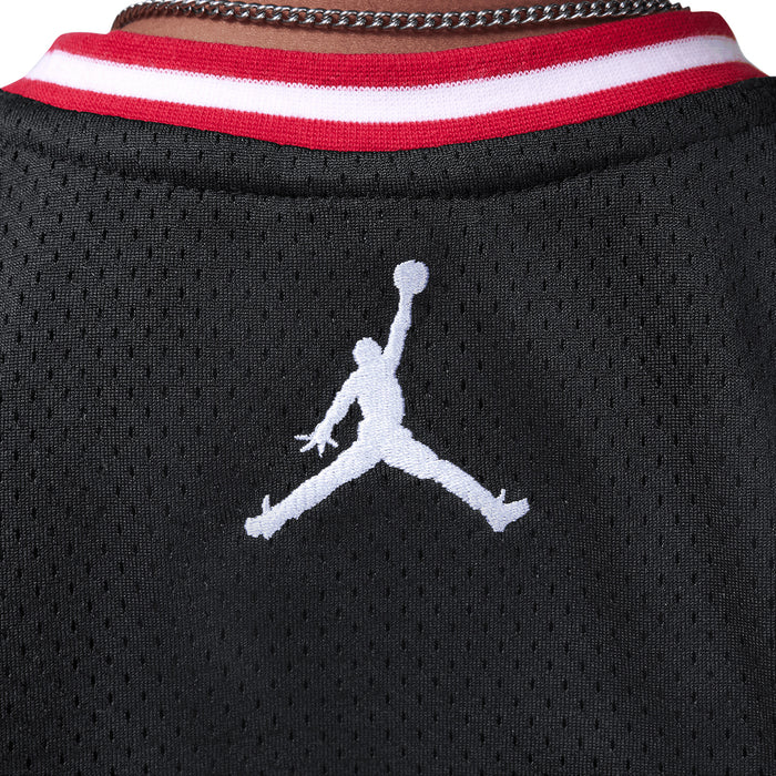 Black jersey collar with red-and-white striped trim and white Jumpman logo