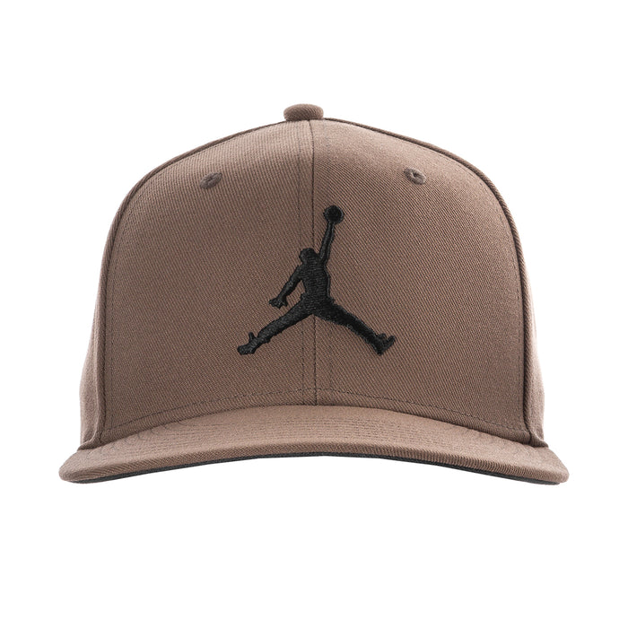 Taupe snapback cap with embroidered black Jumpman logo and curved brim