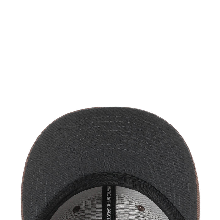 Snapback cap interior close-up with stitched eyelets and woven label on brim