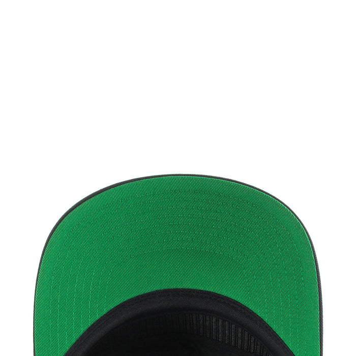 Green inner panel of a snapback cap with black brim edge