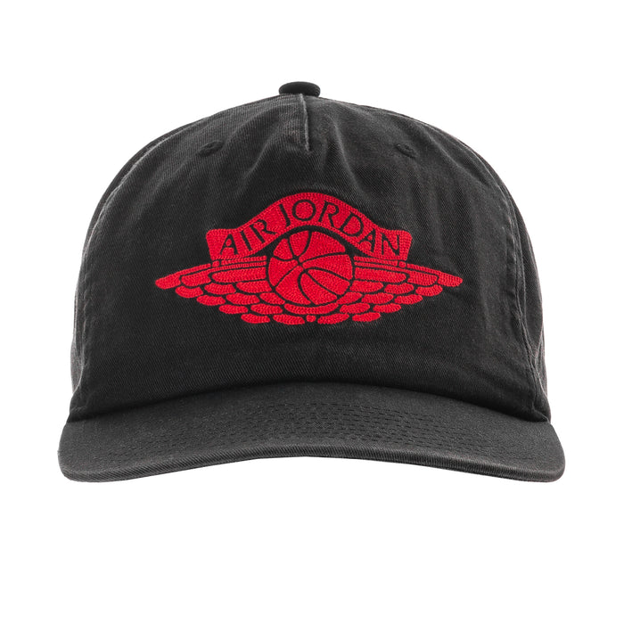 Black unstructured snapback cap with red Jordan wings logo on front.