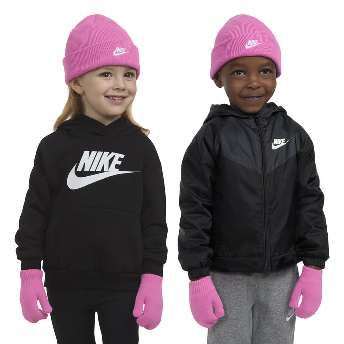 Kids beanie and glove set on model: pink beanie with Nike logo, pink gloves