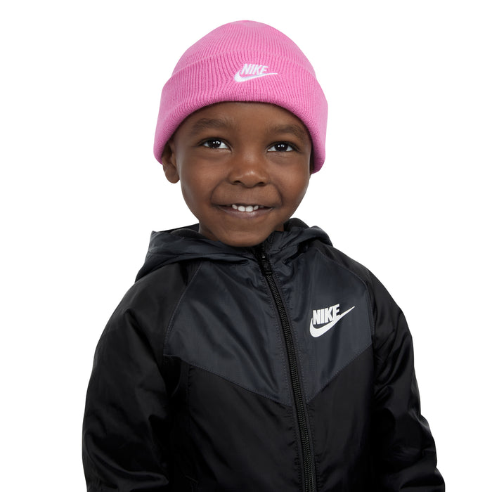 Kids pink knit beanie with Nike logo, close-up on child