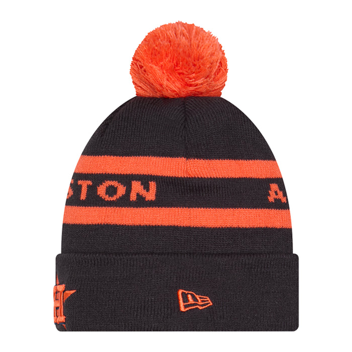Two-tone knit beanie in dark navy with orange stripes, orange pom, team logo patch