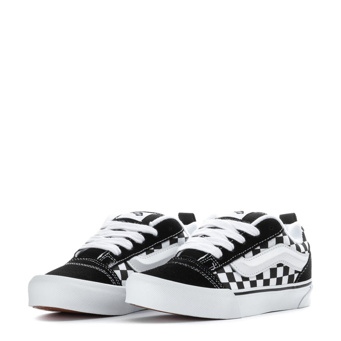 Kids low-top sneakers, black and white checkered panels, white laces, rubber sole