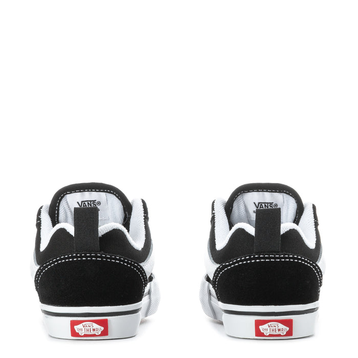 Toddler black sneakers with white heel stripe, lace tab, and Vans logo on back
