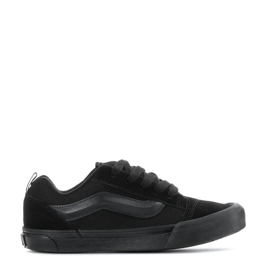 Youth low-top sneakers in black, lace-up with side stripe and flat rubber sole