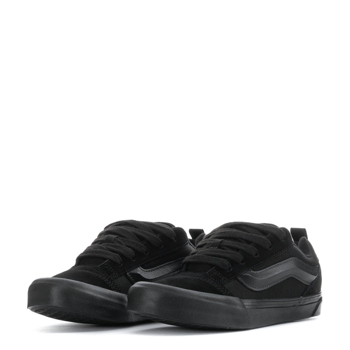 Youth low-top sneakers in black, lace-up top view with cushioned low profile sole