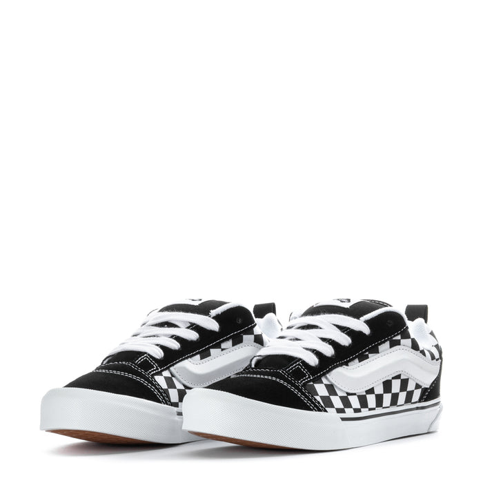 Youth checkerboard low-top sneakers, front view with white laces and black toe caps