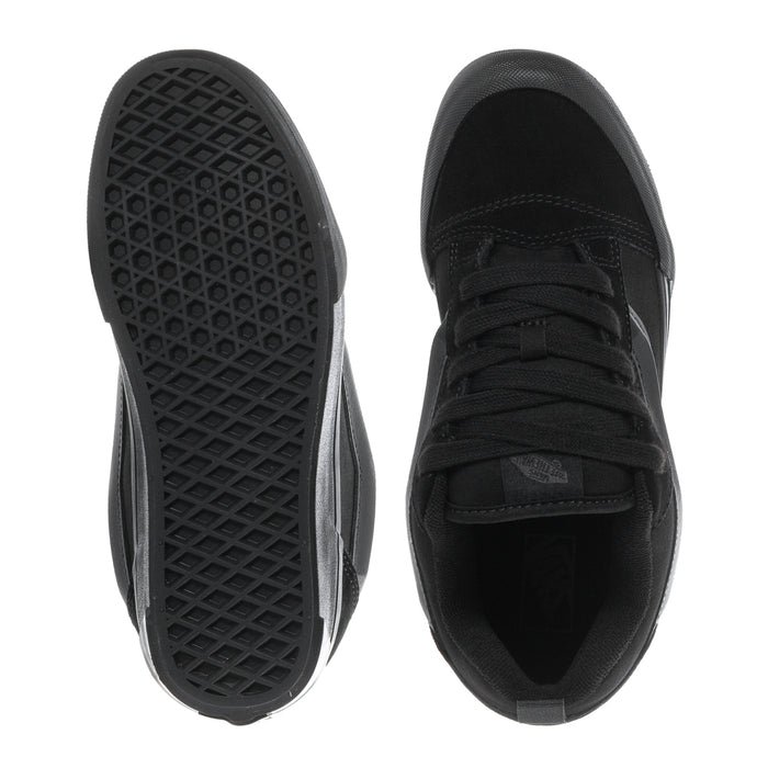 Black youth sneakers outsole and toe view, textured rubber tread and lace collar