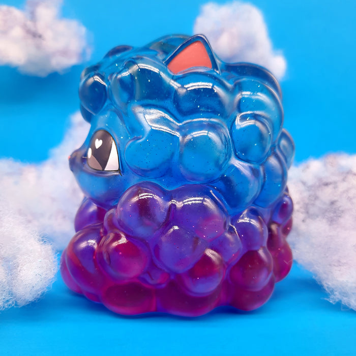 Kumo Kitty - Nightfall, a 4-inch cloud cat toy with a whimsical cartoon face, perfect for weather-themed adventures. Limited edition resin piece by The Bots.