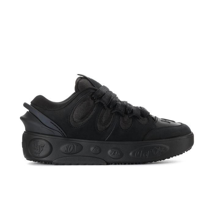 Black men's low-top skate shoe with lace-up front and textured PUMA logo details