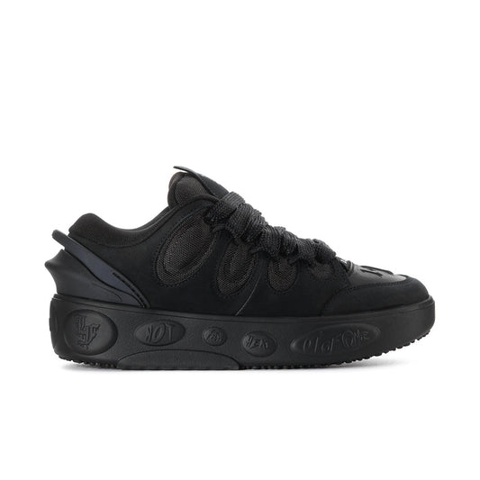 Black men's low-top skate shoe with lace-up front and textured PUMA logo details