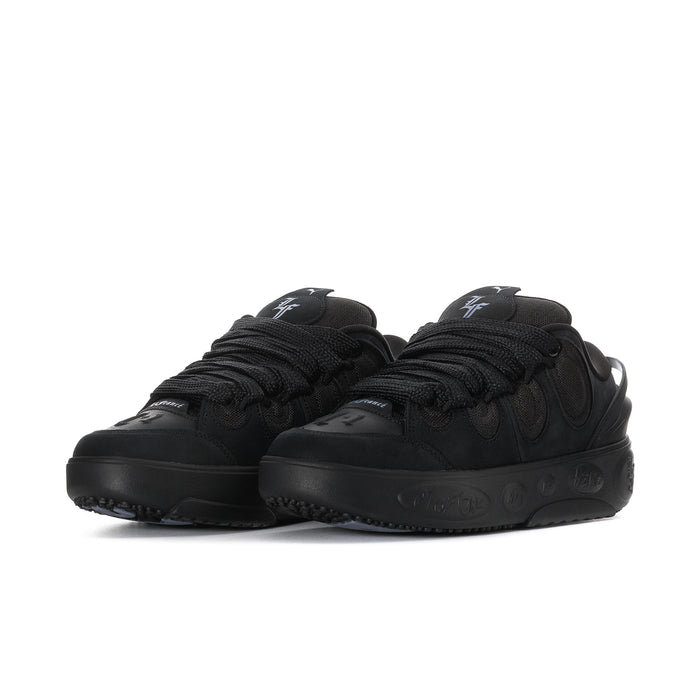 Black lace-up skate sneakers with thick rubber outsole and side PUMA logos