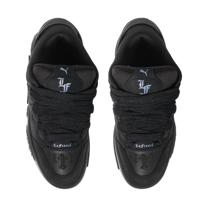 Black skate sneakers, top view with La France heel patch and lace-up collar