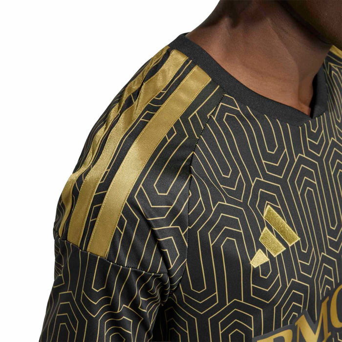 Black jersey sleeve with gold stripe accents and geometric pattern