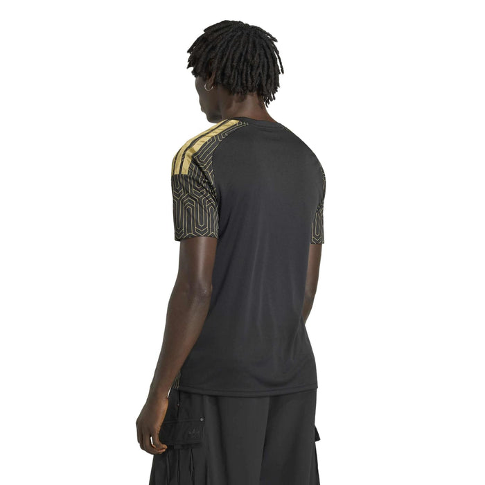 Black replica home jersey back view with gold geometric trim on shoulders