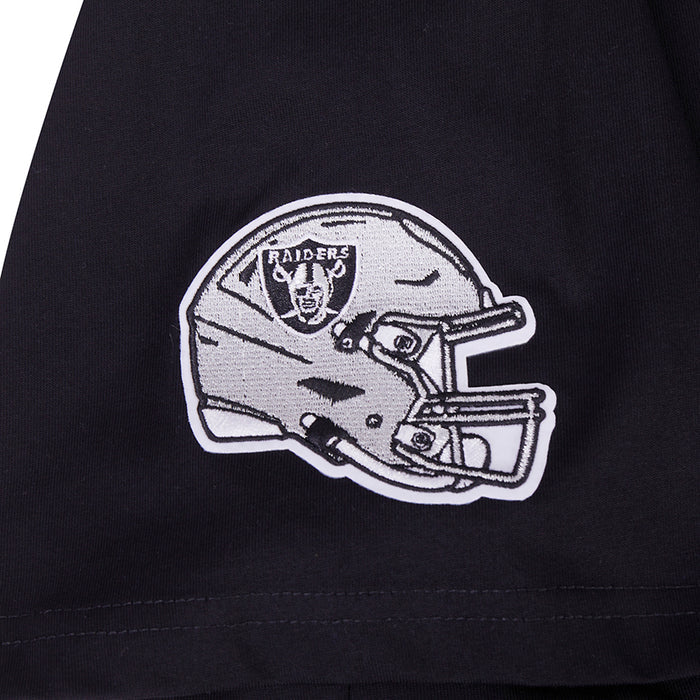 Close-up of helmet-and-helmet Raiders logo patch on black T-shirt