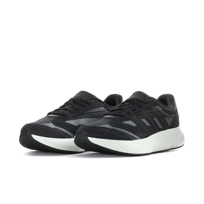 Black running sneakers with white soles and side stripes; lace-up sporty profile