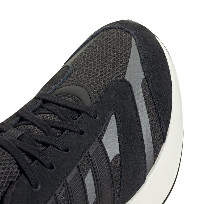 Close-up of black mesh upper with lace and molded three-stripe overlays