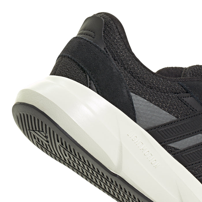 Close-up of black sneaker heel with white midsole and outsole tread