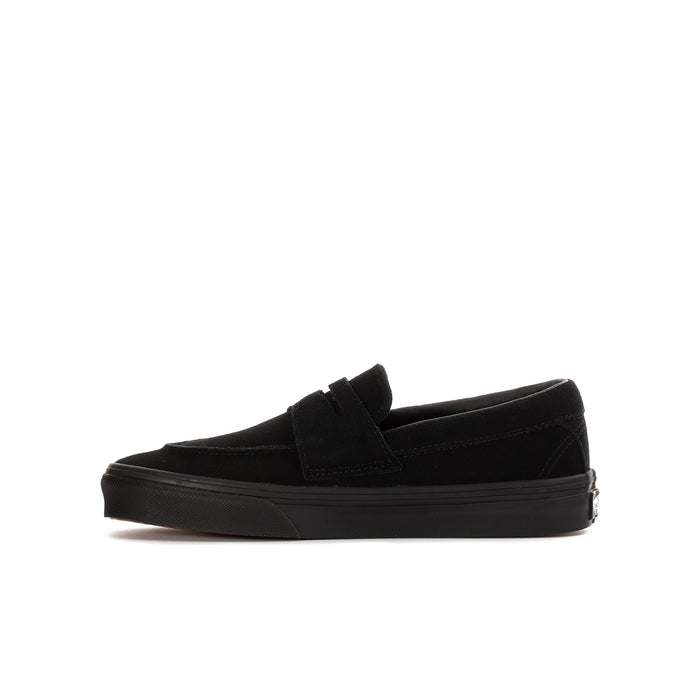Youth black Vans slip-on loafer, side profile with strap and sole
